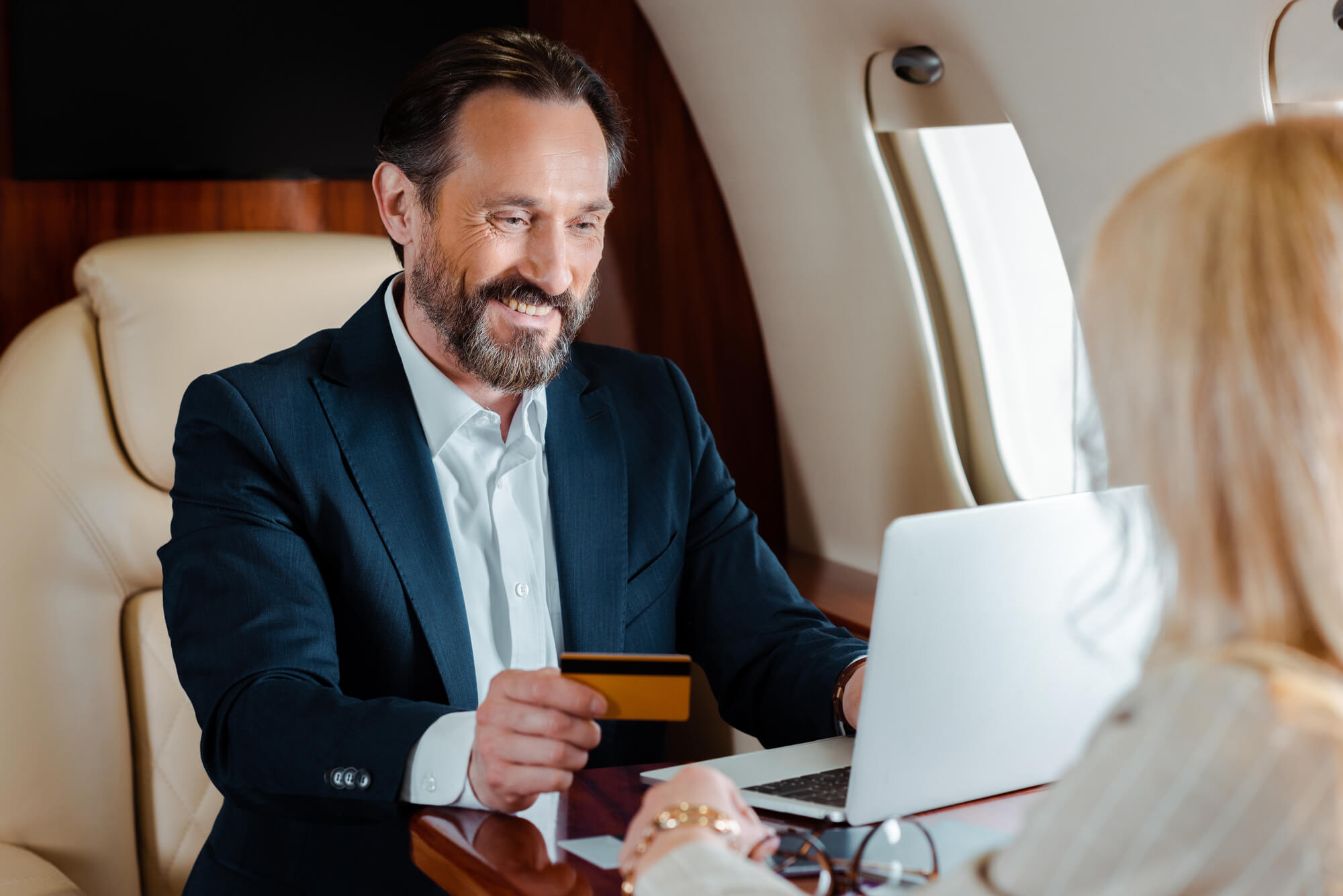 the man on the plane uses a private jet card