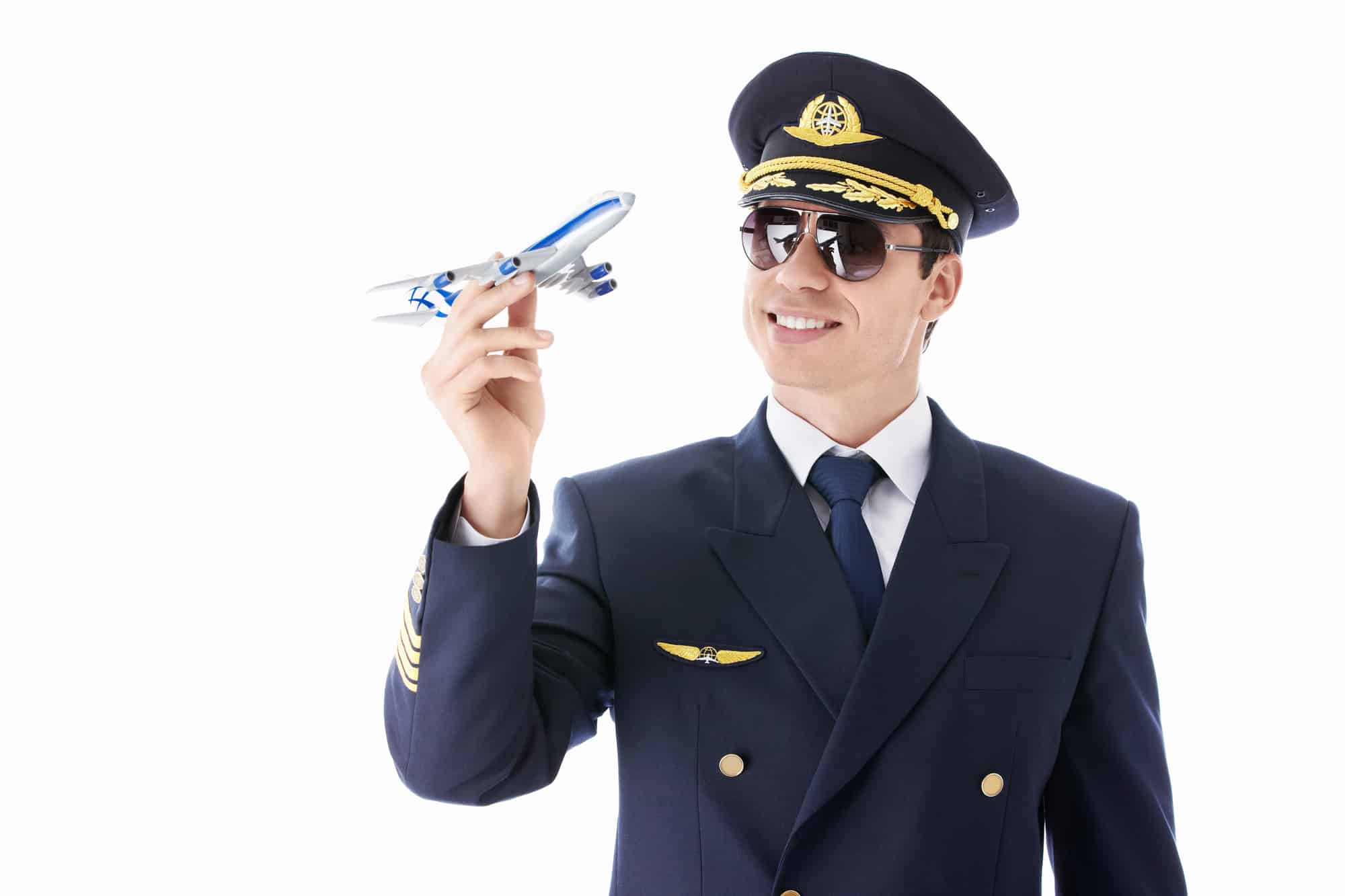 A pilot holding a toy airplane